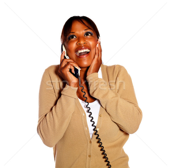 Stock photo: Happy surprised female conversing on phone