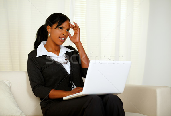 Stock photo: Stressed businesswoman with headache on laptop