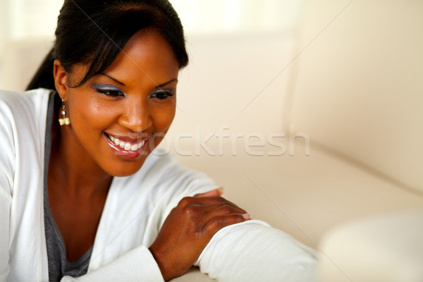 Stylish black female looking down Stock photo © pablocalvog
