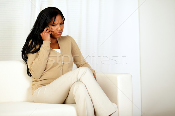 Mulher jovem celular retrato sessão sofá casa Foto stock © pablocalvog