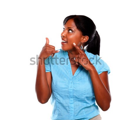 Pensive young black woman on blue shirt Stock photo © pablocalvog