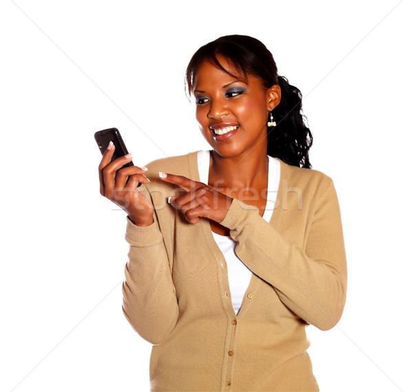 Uśmiechnięty młoda kobieta wskazując odizolowany telefonu Zdjęcia stock © pablocalvog