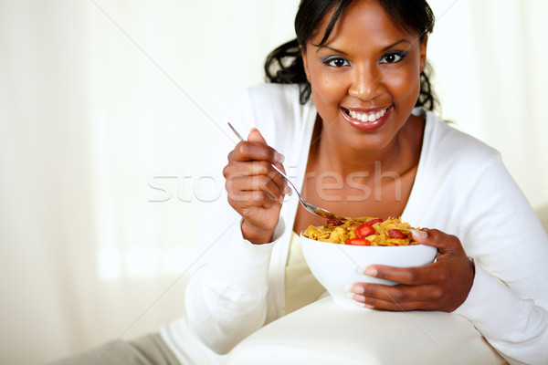 Smiling female looking at you having breakfast Stock photo © pablocalvog