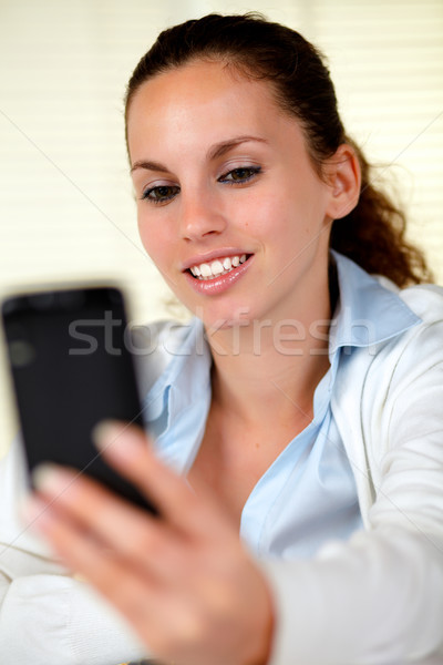 Caucasian woman browsing the internet on cellphone Stock photo © pablocalvog