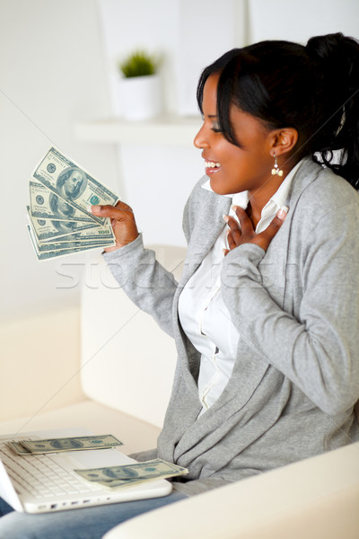 Woman holding and looking to plenty of cash money Stock photo © pablocalvog