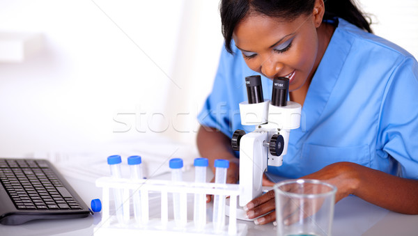 Bilimsel kadın mavi üniforma çalışma laboratuvar Stok fotoğraf © pablocalvog