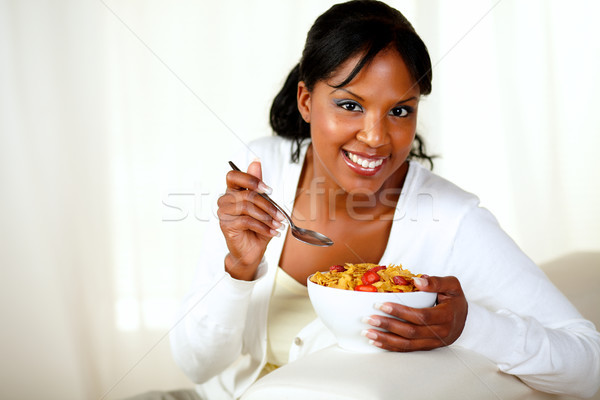 Smiling woman looking at you having breakfast Stock photo © pablocalvog