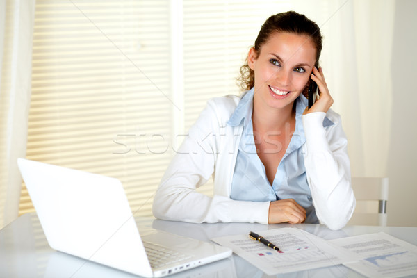 Sorridente secretário celular laptop escritório Foto stock © pablocalvog
