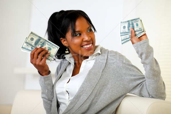 Charming young woman holding plenty of cash money Stock photo © pablocalvog