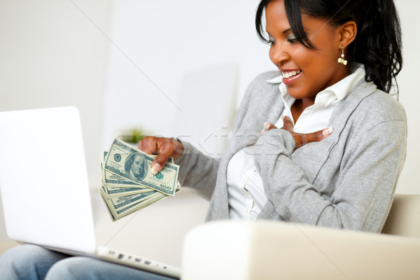 Ambiciózus izgatott fiatal nő pénz portré ül Stock fotó © pablocalvog