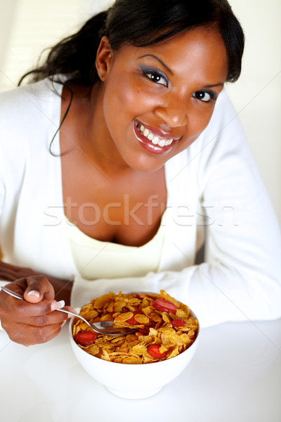 Smiling woman looking at you and having breakfast Stock photo © pablocalvog