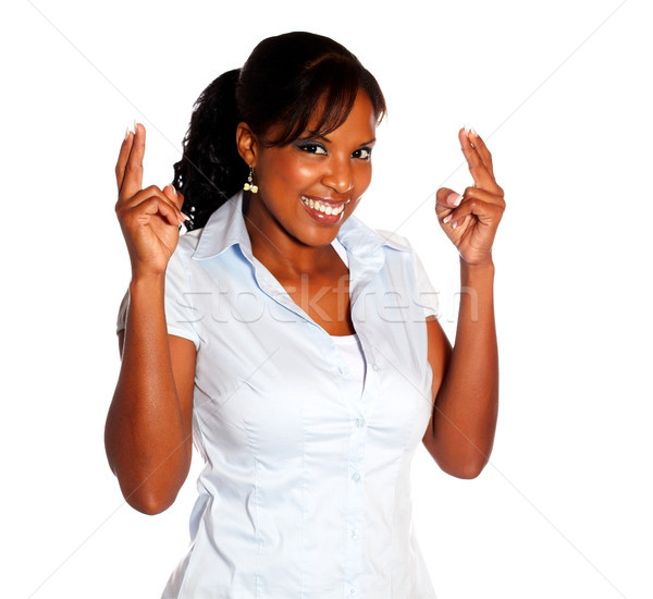 Pretty young woman crossing fingers Stock photo © pablocalvog