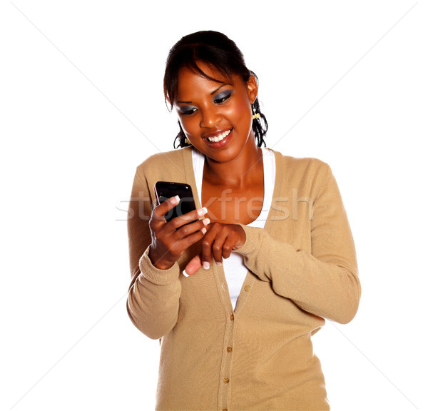 Bájos fiatal nő küldés üzenet mobiltelefon fehér Stock fotó © pablocalvog