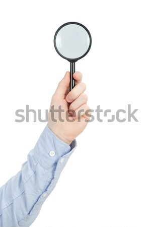  hand holding magnifying glass Stock photo © Pakhnyushchyy