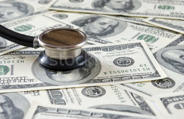 Stock photo: stethoscope on money