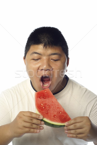 Asian Mann essen Wasser Melone Stock foto © palangsi