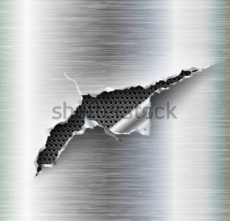 Stock photo: ragged hole in the metal