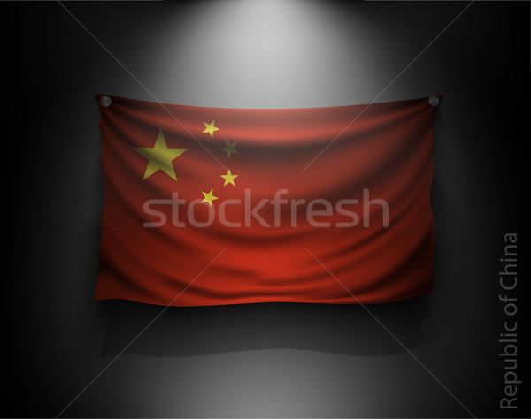 waving flag on a dark wall with a spotlight, illuminated Stock photo © Panaceadoll