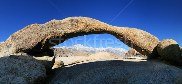 mountain peaks through arch Stock photo © pancaketom