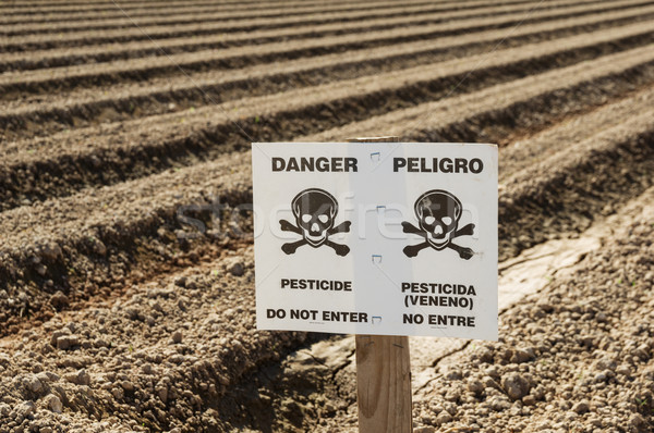 Danger Pesticide Sign In Field Stock photo © pancaketom
