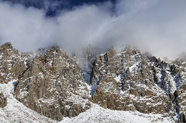 Snowy Cliffs With Clouds Stock photo © pancaketom