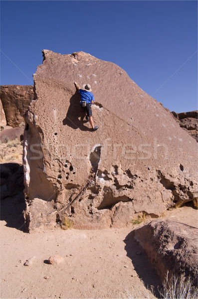 man climbing boulder Stock photo © pancaketom