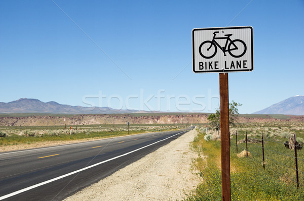 Bike Lane Sign On Side Of Road Stock photo © pancaketom