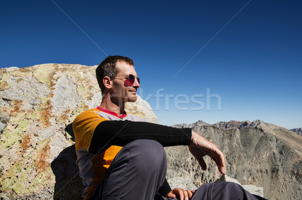 Man Sitting On Mountain Top Stock photo © pancaketom