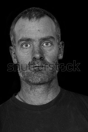 Egyenetlen férfi portré középkorú férfi fekete póló Stock fotó © pancaketom