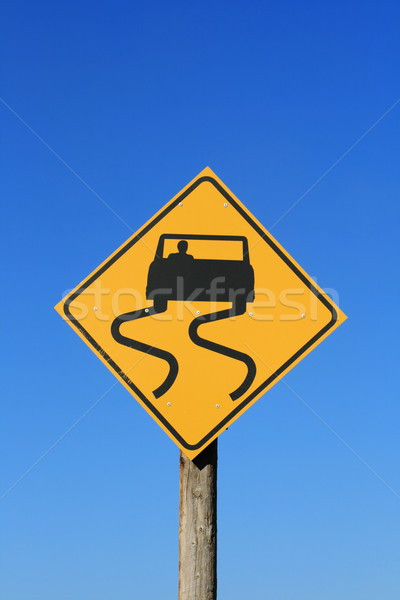 скользкий дорожный знак автомобилей черный желтый Blue Sky Сток-фото © pancaketom