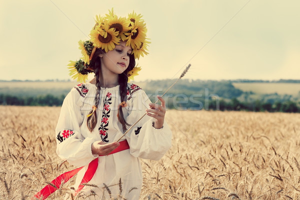 A photo of little beautiful girl is in vintag national clothes Stock photo © pandorabox