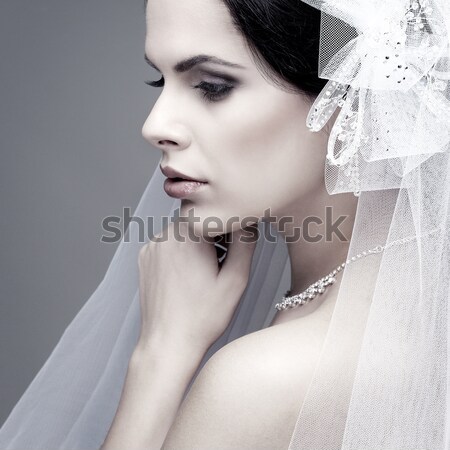 Portrait of beautiful sexual brunette on a grey background, emotions, cosmetics Stock photo © pandorabox