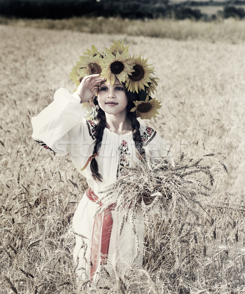 A photo of little beautiful girl is in vintag national clothes Stock photo © pandorabox