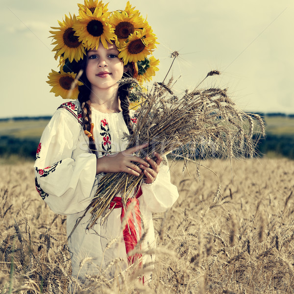 A photo of little beautiful girl is in vintag national clothes Stock photo © pandorabox