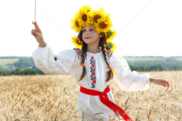 A photo of little beautiful girl is in vintag national clothes Stock photo © pandorabox