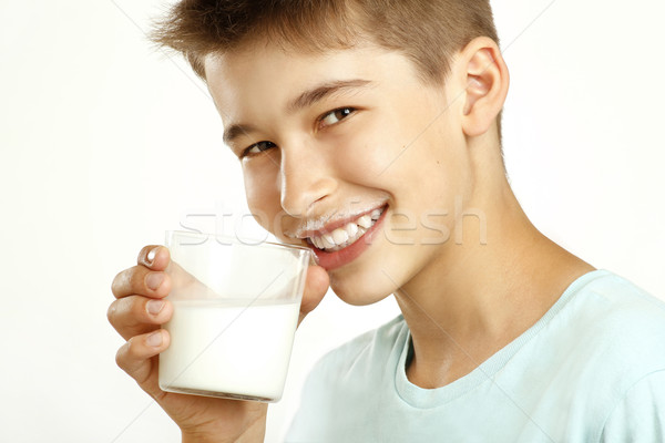 Ragazzo bere latte bianco faccia uomo Foto d'archivio © paolopagani