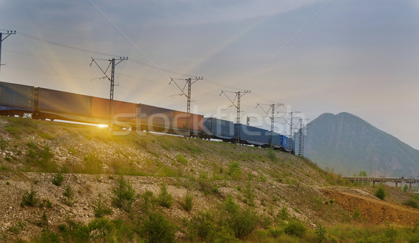 Stock photo: Freight train passing by on sunset 