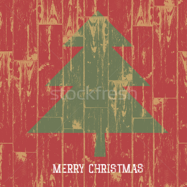 Christmas tree symbol and greetings on wooden planks texture. Ve Stock photo © pashabo