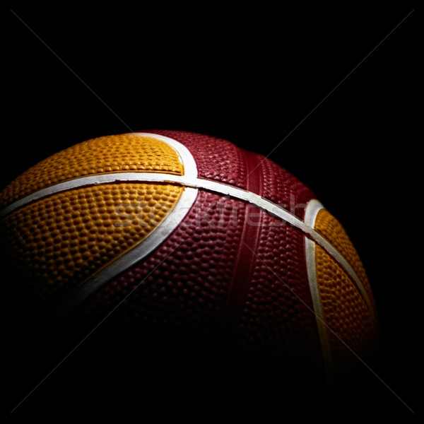 Stock photo: Close-up of a basketball isolated on black background