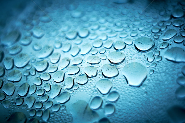 Abstract blue bubbles background. Liquid on dirty glass Stock photo © pashabo