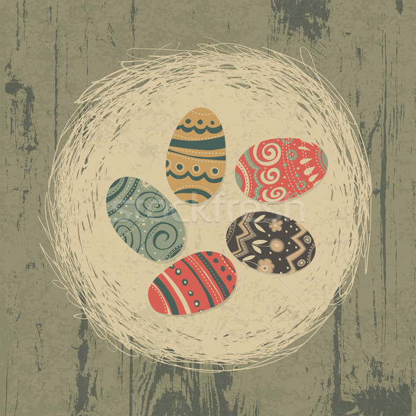 Easter eggs in nest on wooden texture. Easter background, retro  Stock photo © pashabo