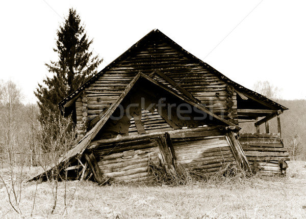 Stock photo: Old abandoned, collasping russian rural house