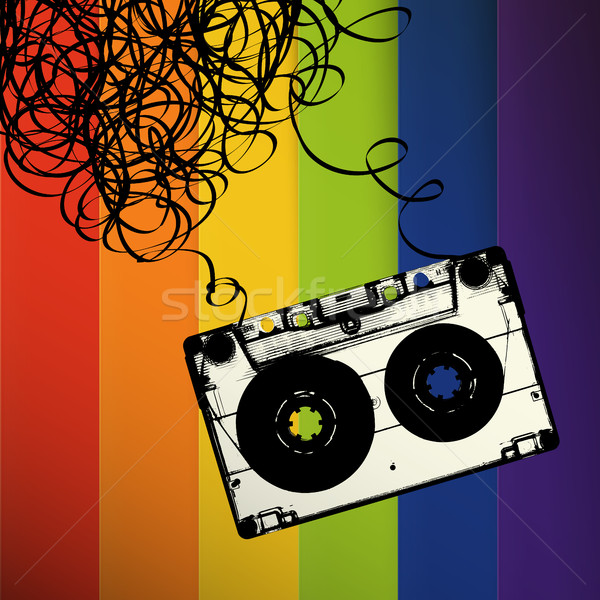 Audiocassette tape with tangled. On rainbow stripes background Stock photo © pashabo
