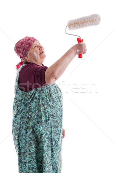 Senior with a paint roller Stock photo © Pasiphae