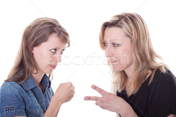 two pretty women are playing rock, paper, scissors Stock photo © Pasiphae