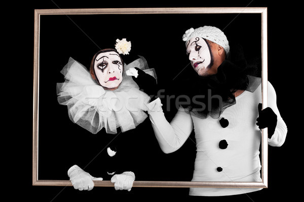 two clowns in a frame, one looks sorrowful Stock photo © Pasiphae