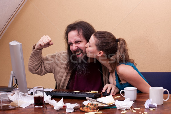 Nerd celebrates success at the computer, woman's kiss Stock photo © Pasiphae