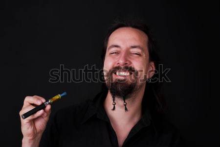 attrictiv man smoking electric cigarette Stock photo © Pasiphae