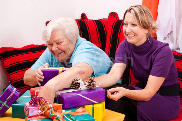 female senior and pretty daughter with presents Stock photo © Pasiphae