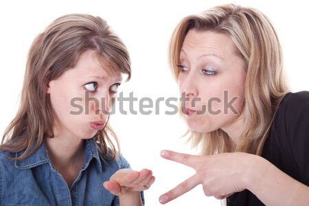 two angry woman faces the viewer Stock photo © Pasiphae